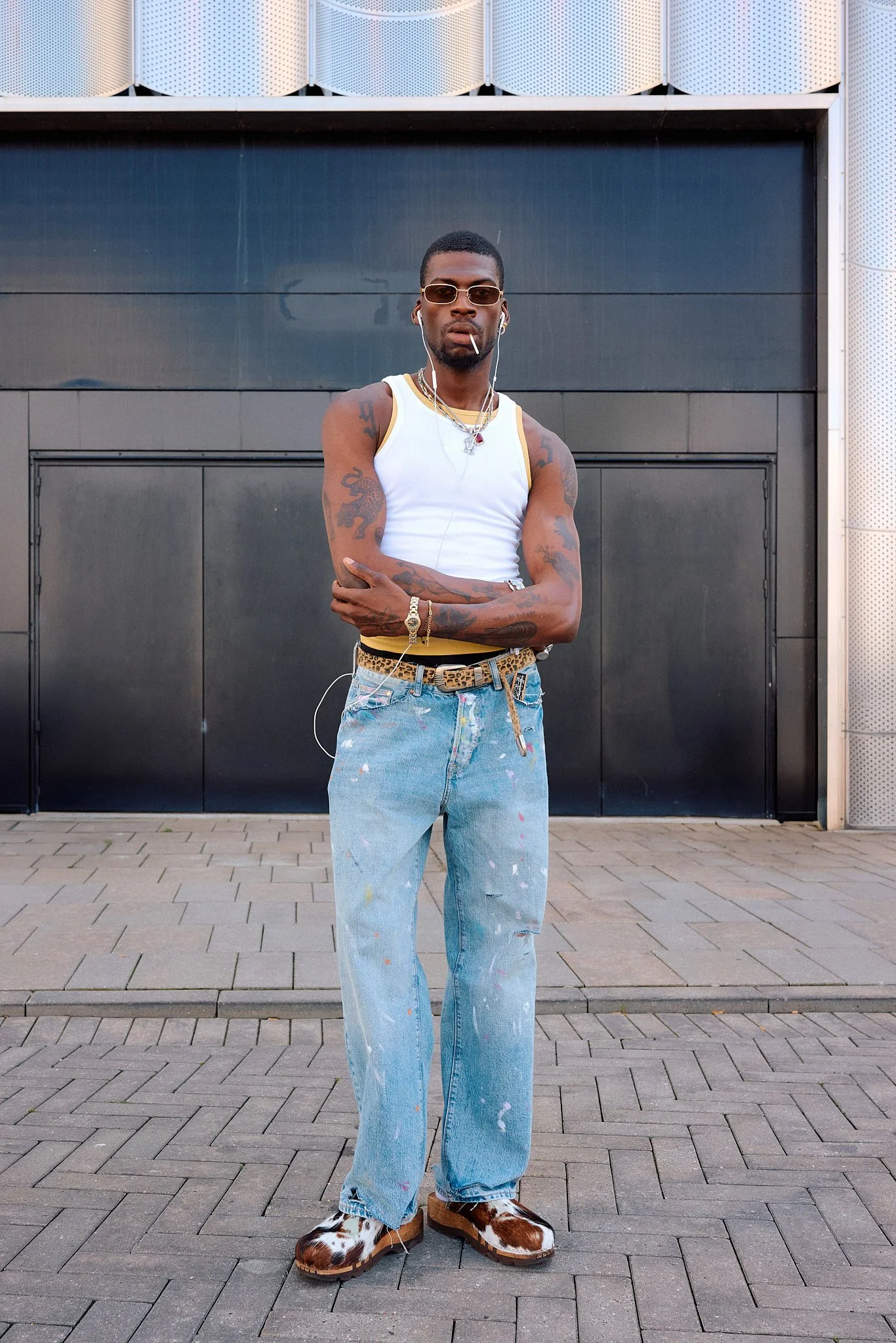 Street Style Photography: Copenhagen Fashion Week Spring/Summer for "Spotted by Pinterest" Campaign - Paint Splattered Denim and Cowhide Clogs