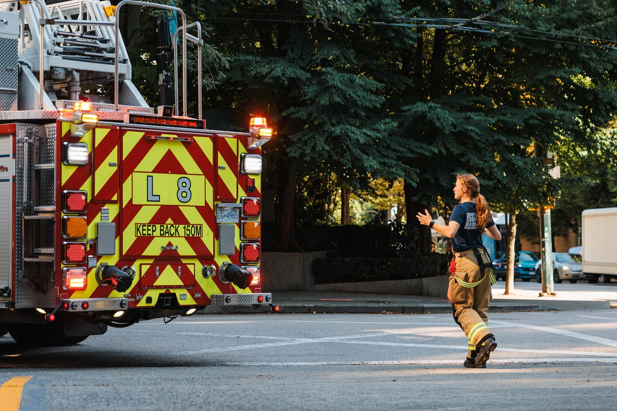 Advertising Photography | Firefighter Guiding a Ladder Truck