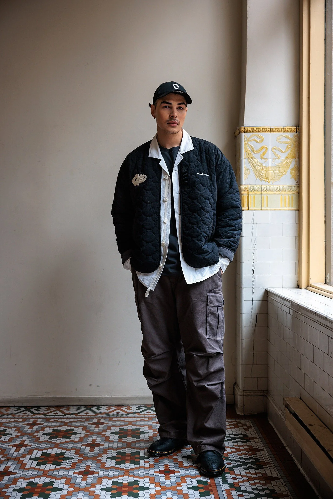 Portrait Photographer London | Quilted Jacket on Patterned Tile for Open Dialogue