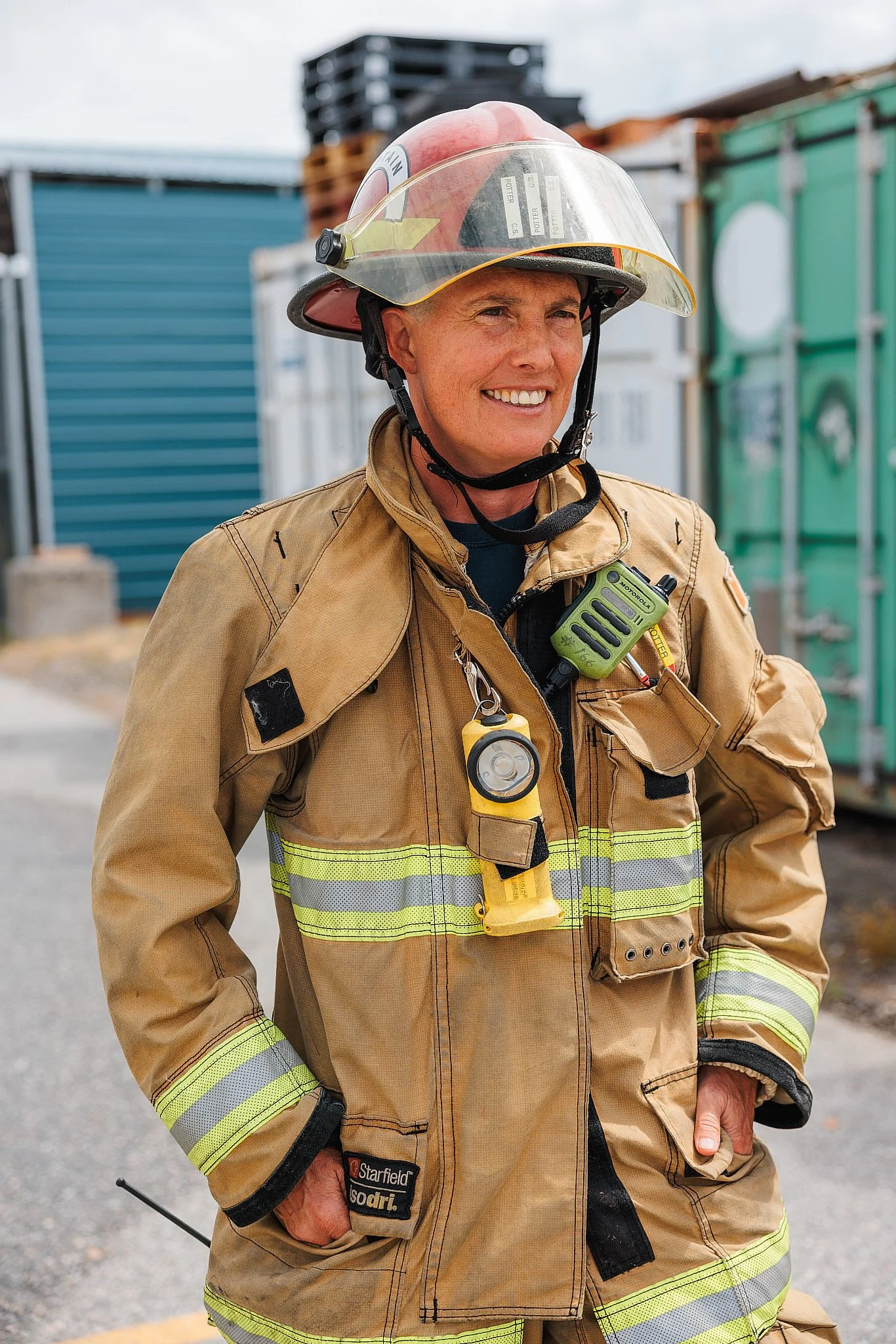 Portrait Photographer London | Fire Captain Smiling with Helmet Up