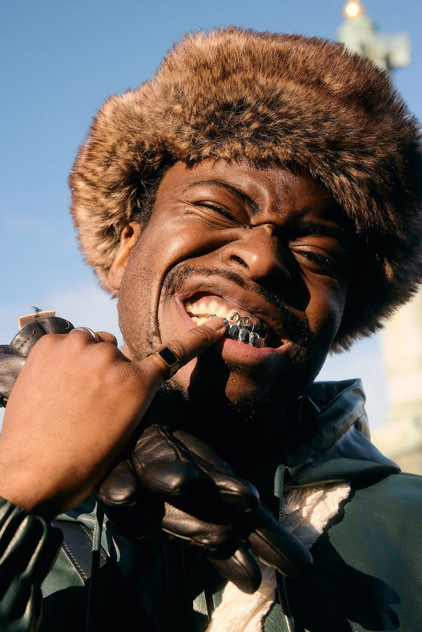 Portrait Photographer London | Fur Hat and Gold Teeth at Paris Fashion Week