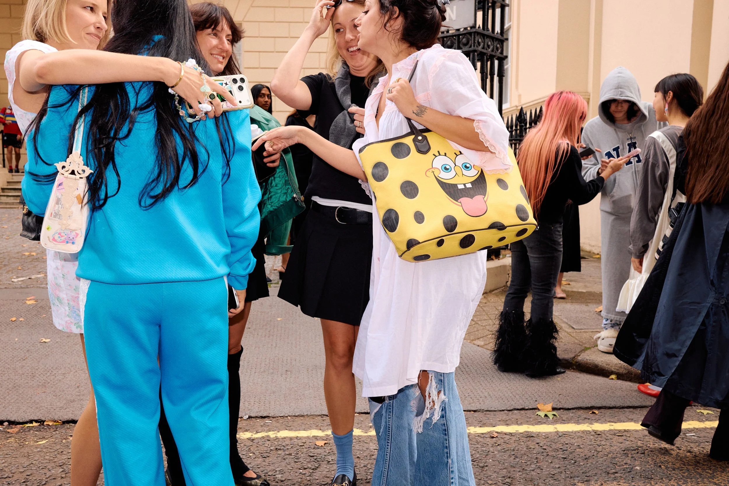 London Fashion Week Candid | Hugs Outside the Shows