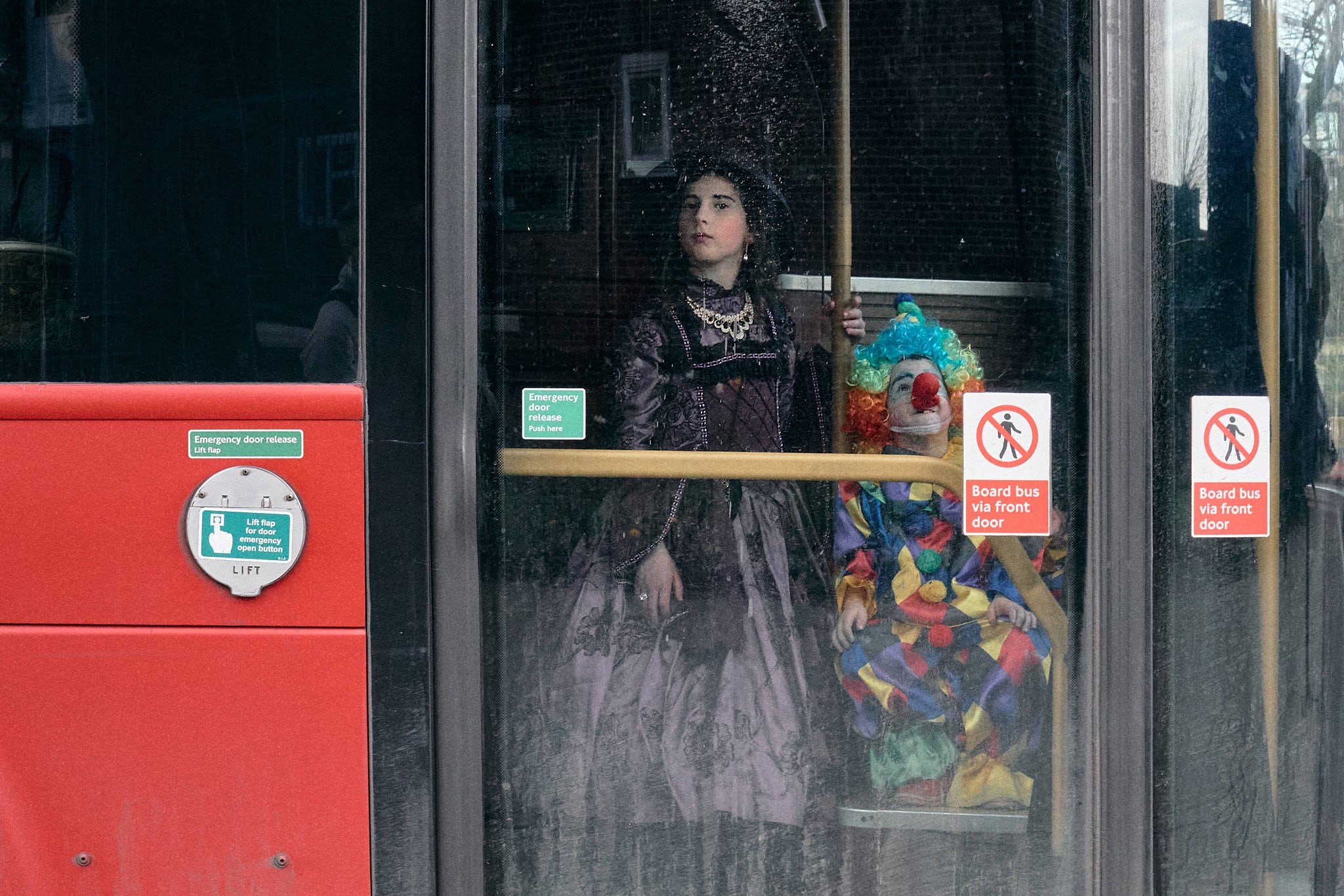 Purim Street Photography | Through the Bus Doors