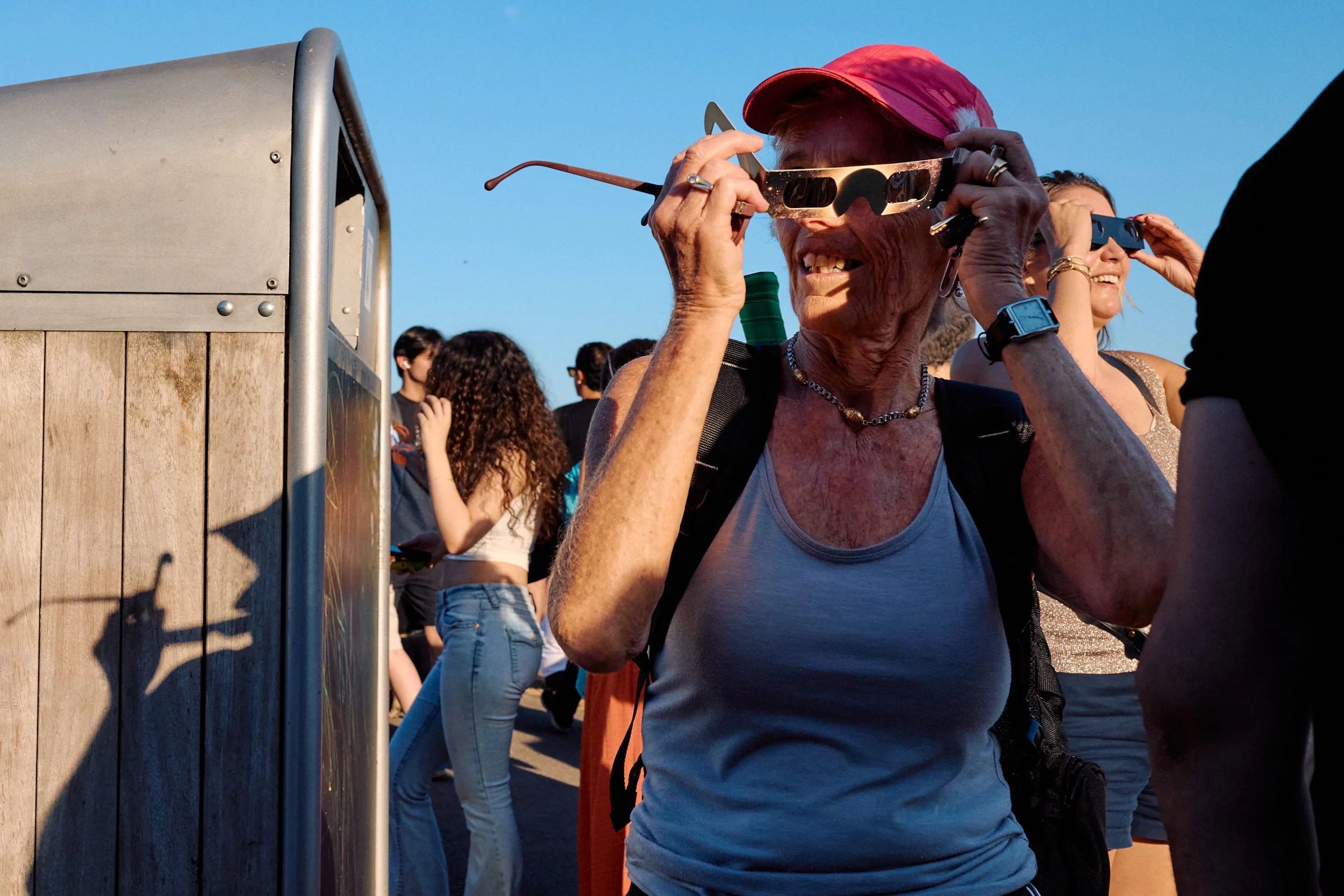 London Street Photography | Pink Cap and Paper Glasses