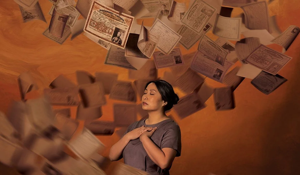 Advertising photographer London campaign image for out-of-home commercial lifestyle campaign of Chinese woman with hands on chest with tornado of historic Head Tax certificates swirling around her on orange.