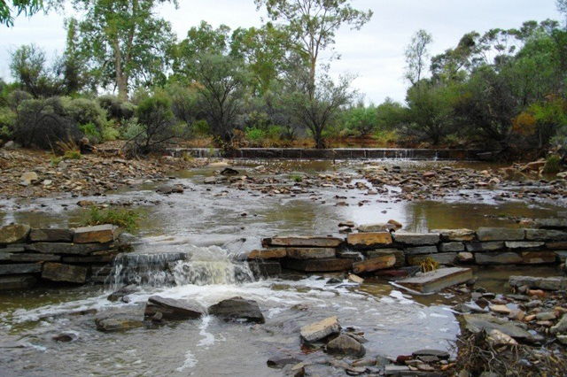  Floodwaters flowing over the old weir in Graham's Creek 