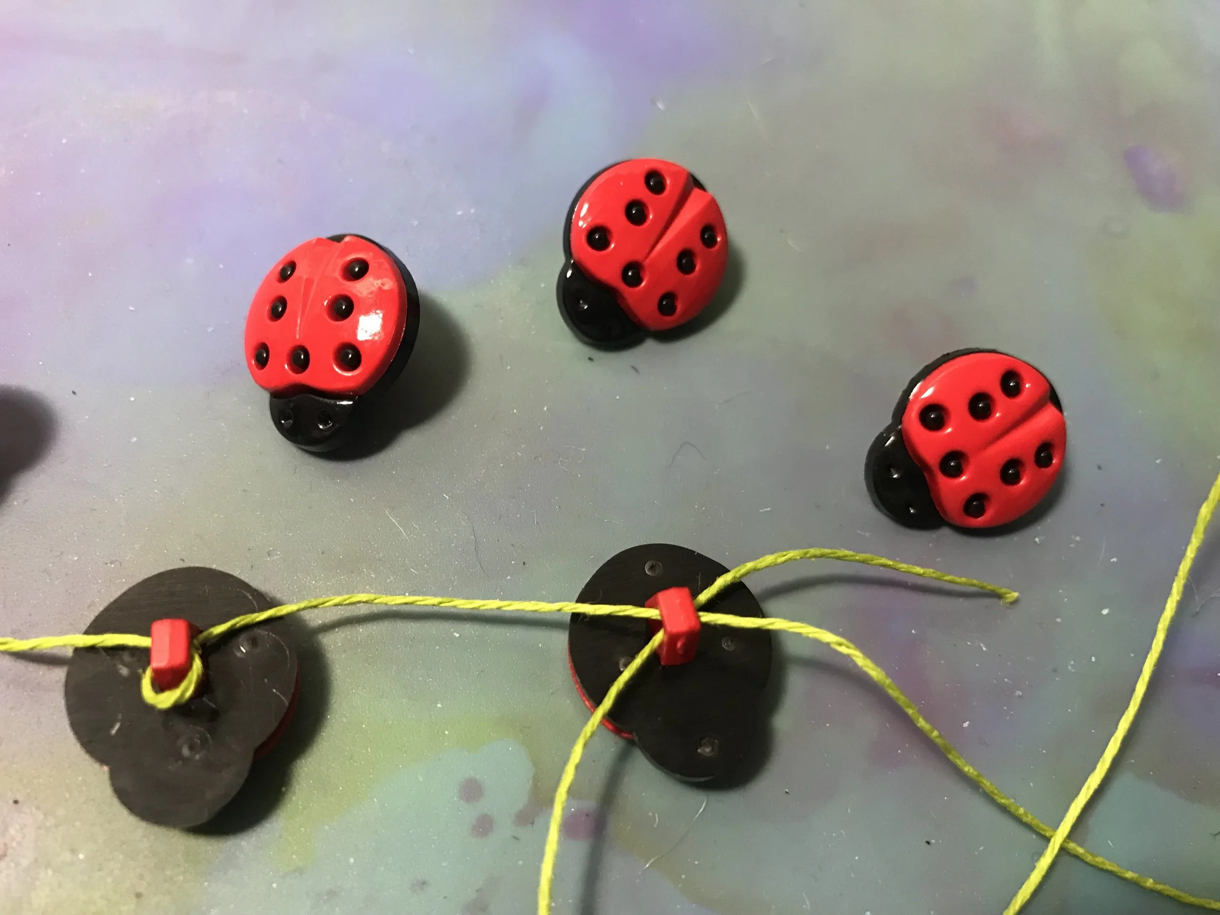 example of wrapped thread around button loops
