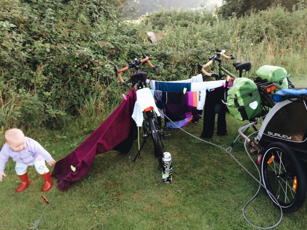  My impromptu clothesline. I dunno why I locked the bikes up... They'd have a dickens of a time stealing the bikes (right outside our tent) with all those clothes on them... 