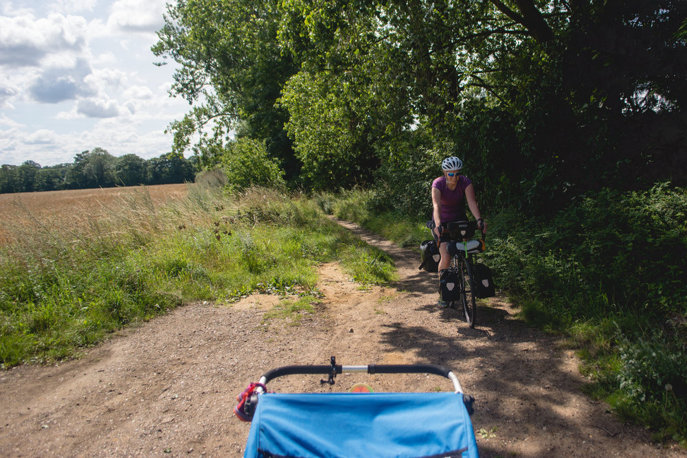  Route 11 through Denver takes this tiny dirt path to cut out going on some main roads. Definitely not suitable for road bikes. As it was, it obviously isn't used that often, because the path was overgrown with stinging nettle. My legs burns for mile