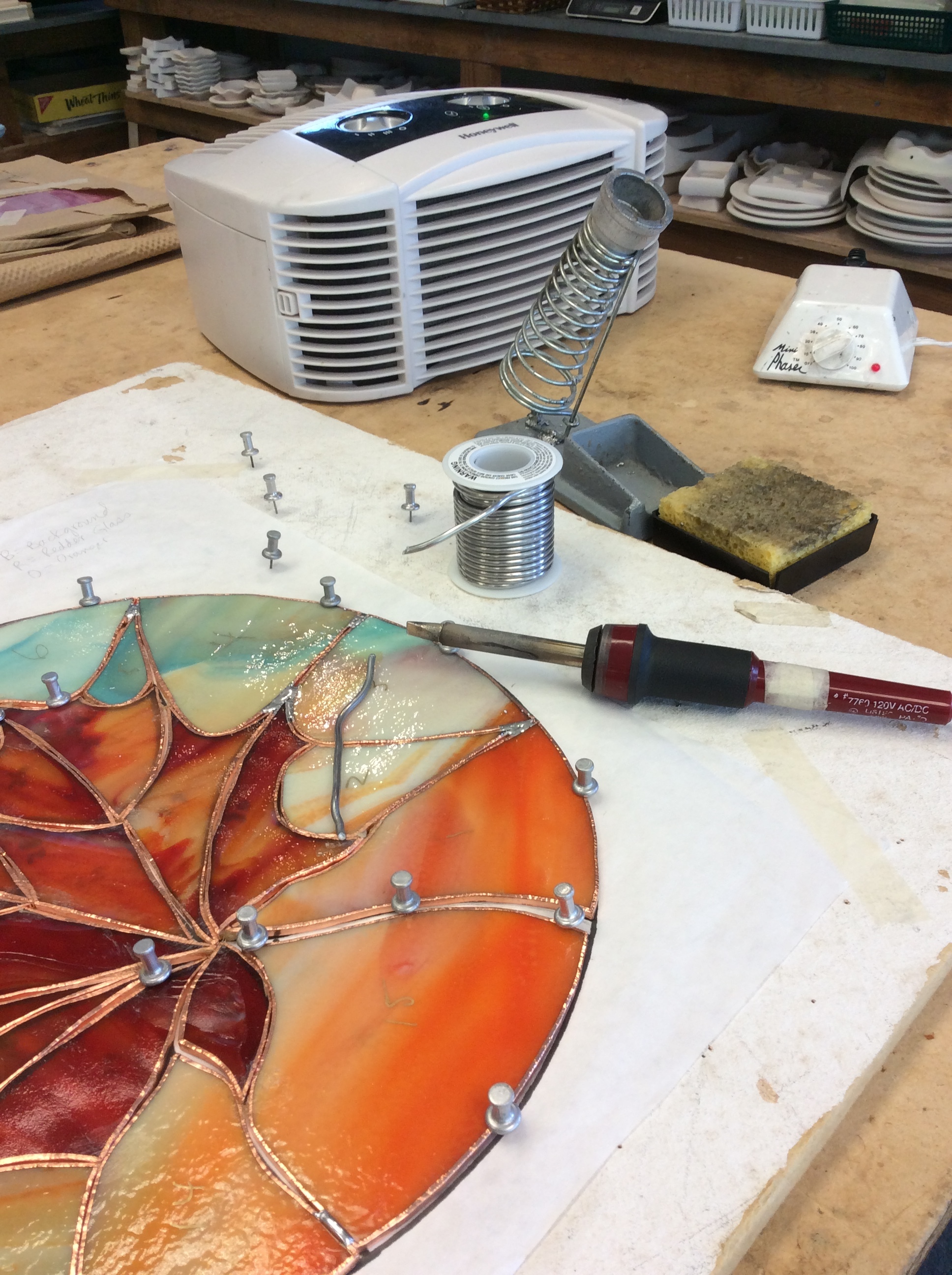 The process of designing and making stained glass. — Yvette M Connor