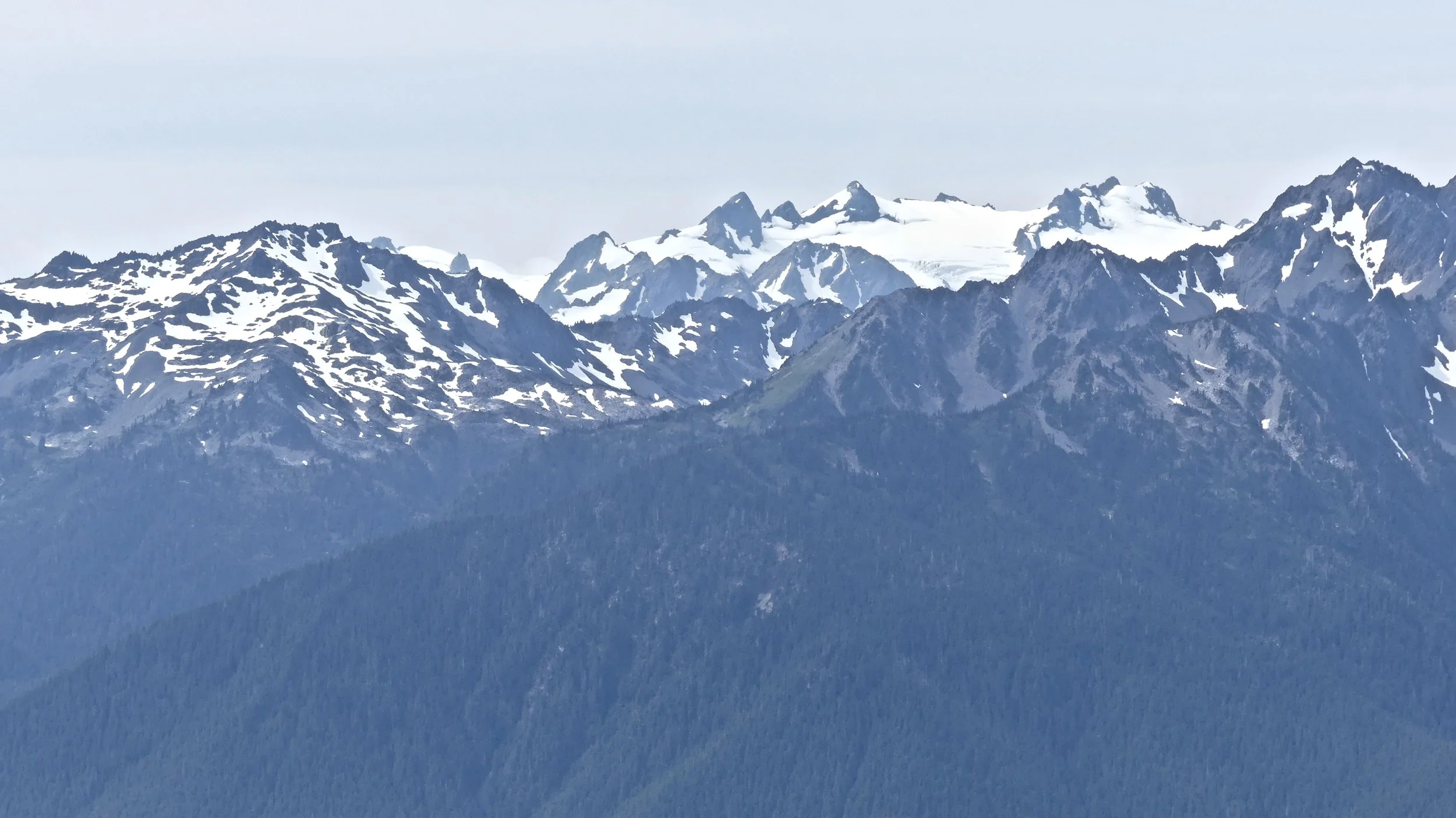Above and below: a glacier and snowfields on Mount Olympus