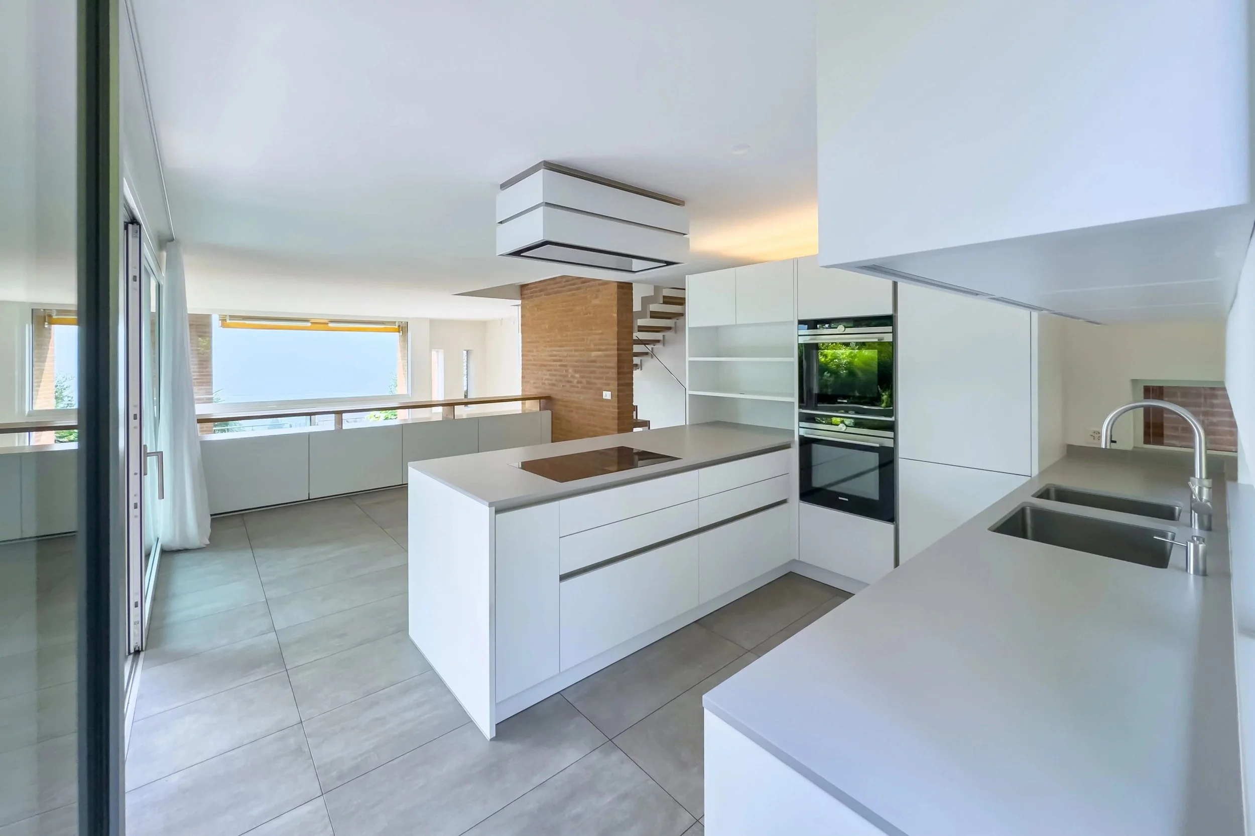 Architectural charm meets Mediterranean lifestyle - Design terraced house with lake view, sunny garden &amp; outdoor lounge in Porza