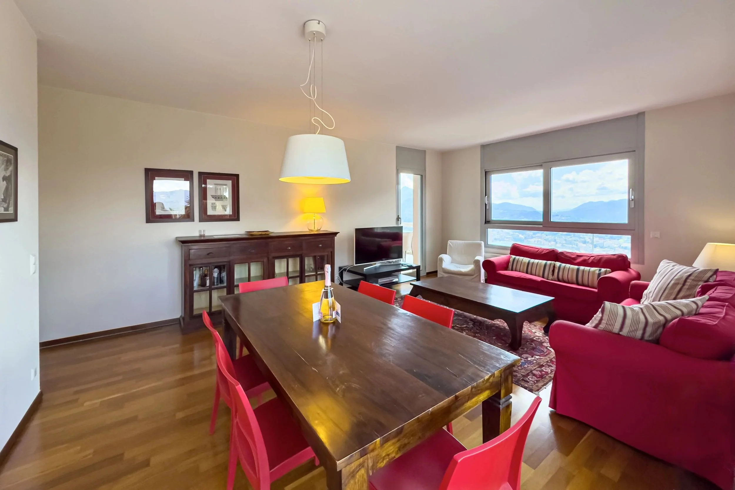 Mediterranean living above Lake Lugano - Stylish apartment with terraces, pool access &amp; unobstructed lake view in Aldesago