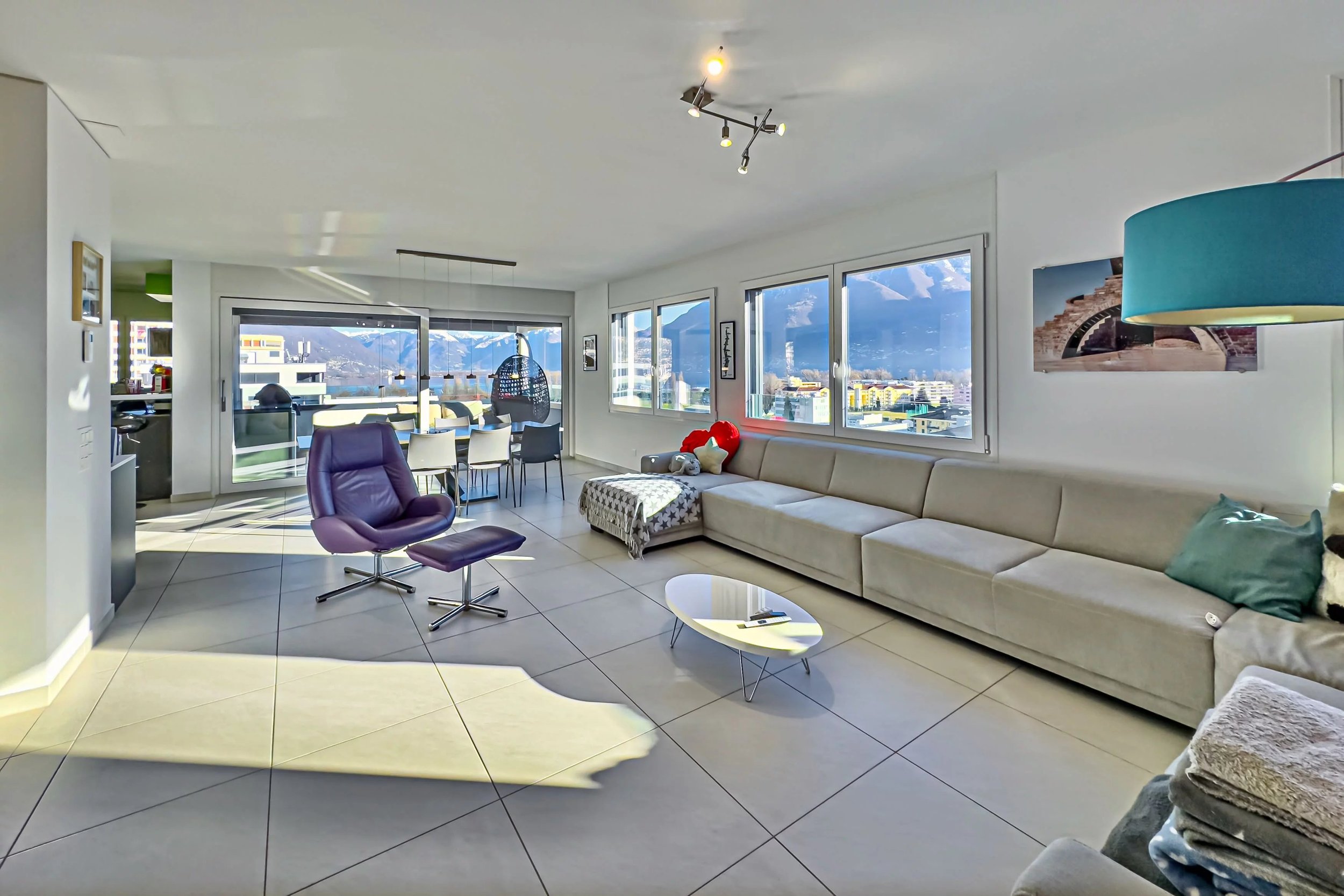 The ideal primary residence with spacious living areas, an open layout, and a wonderful terrace - Elegant penthouse in Locarno with panoramic views