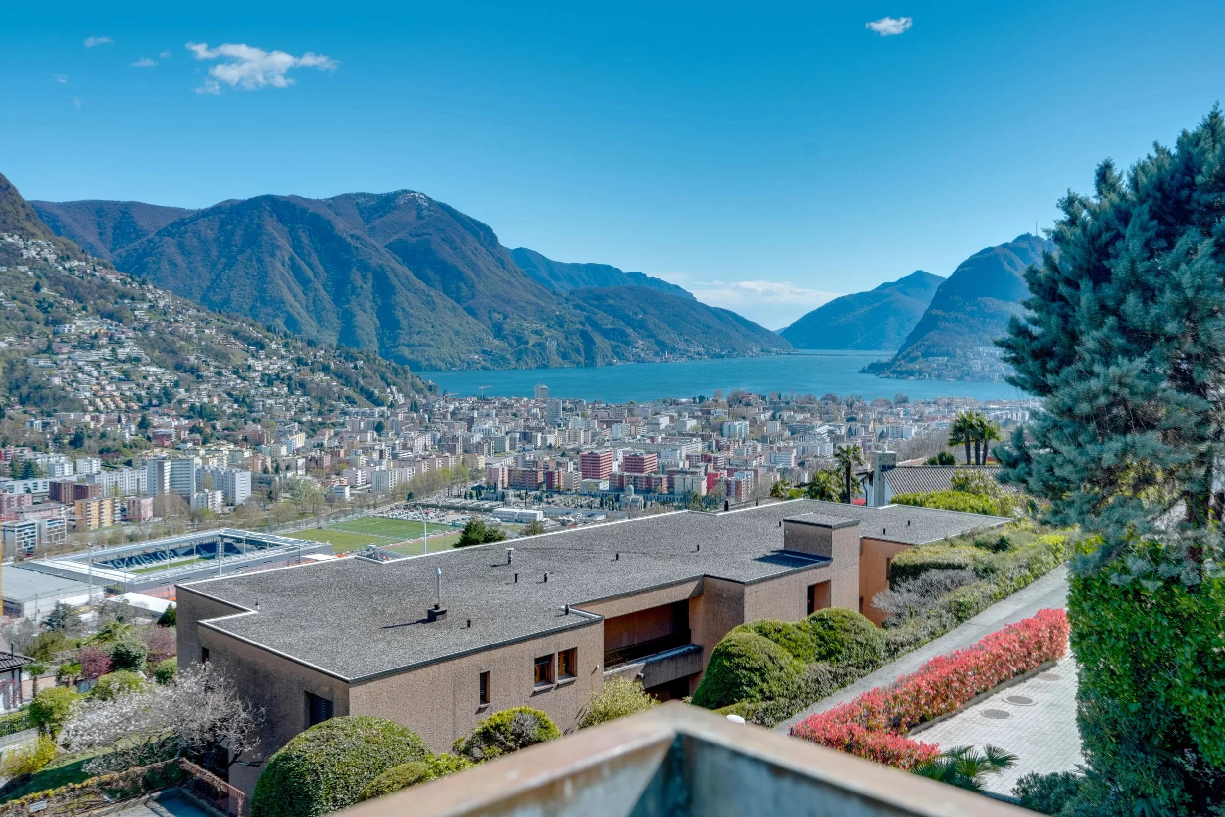 Exclusive penthouse with lake view in Porza - Single-level living with 240 m² of living space, private garden &amp; panoramic views over Lake Lugano