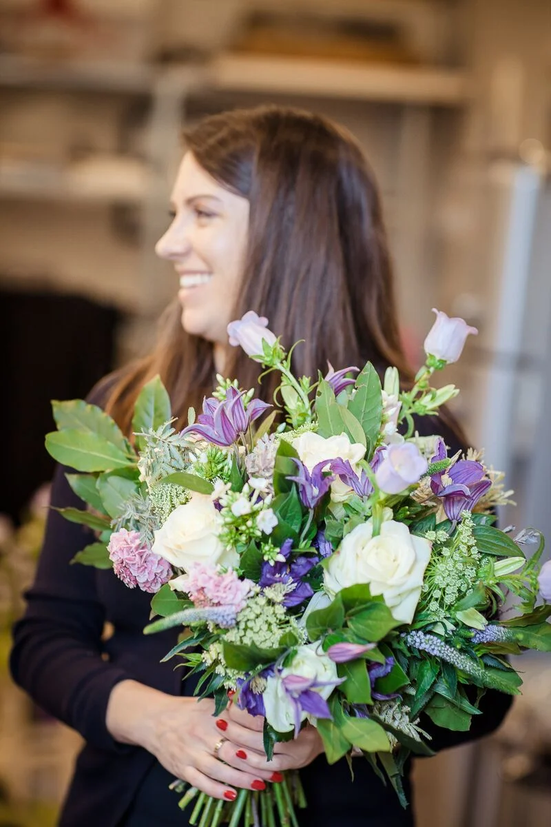 Charlotte in her happy place, creating bespoke arrangements