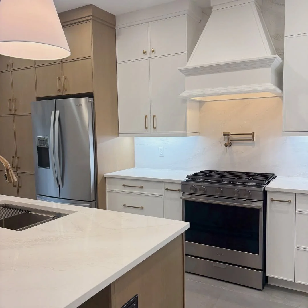 Another fabulous kitchen renovation done by @maximekitchensbaths, featuring the Benjamin Moore colour Vanilla Milkshake OC-59. The gold hardware and off-white pendant shades compliment the warm cast of the paint colour and the natural wood tones. 
.
