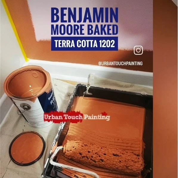 Chris was excited to paint a feature wall for his clients in this vibrant, deep orange using Regal Select in an Eggshell finish. Baked Terra Cotta 1202 by Benjamin Moore has orange and brown undertones that lend a grounding quality to this terra-cott