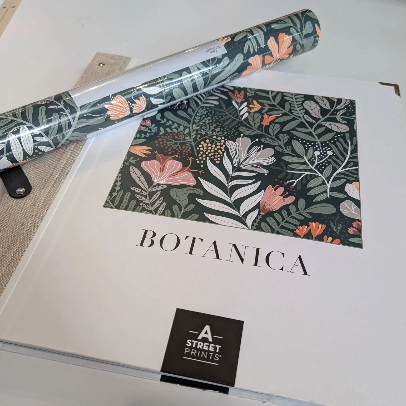 Lush, springtime gardens bloom eternally in this charming Scandinavian-inspired design. The illustrative, whimsical florals are inked in shades of grey, pink, and peach against a dark green background.

By: A-Street Prints
Wallpaper: Brittsommar Ever