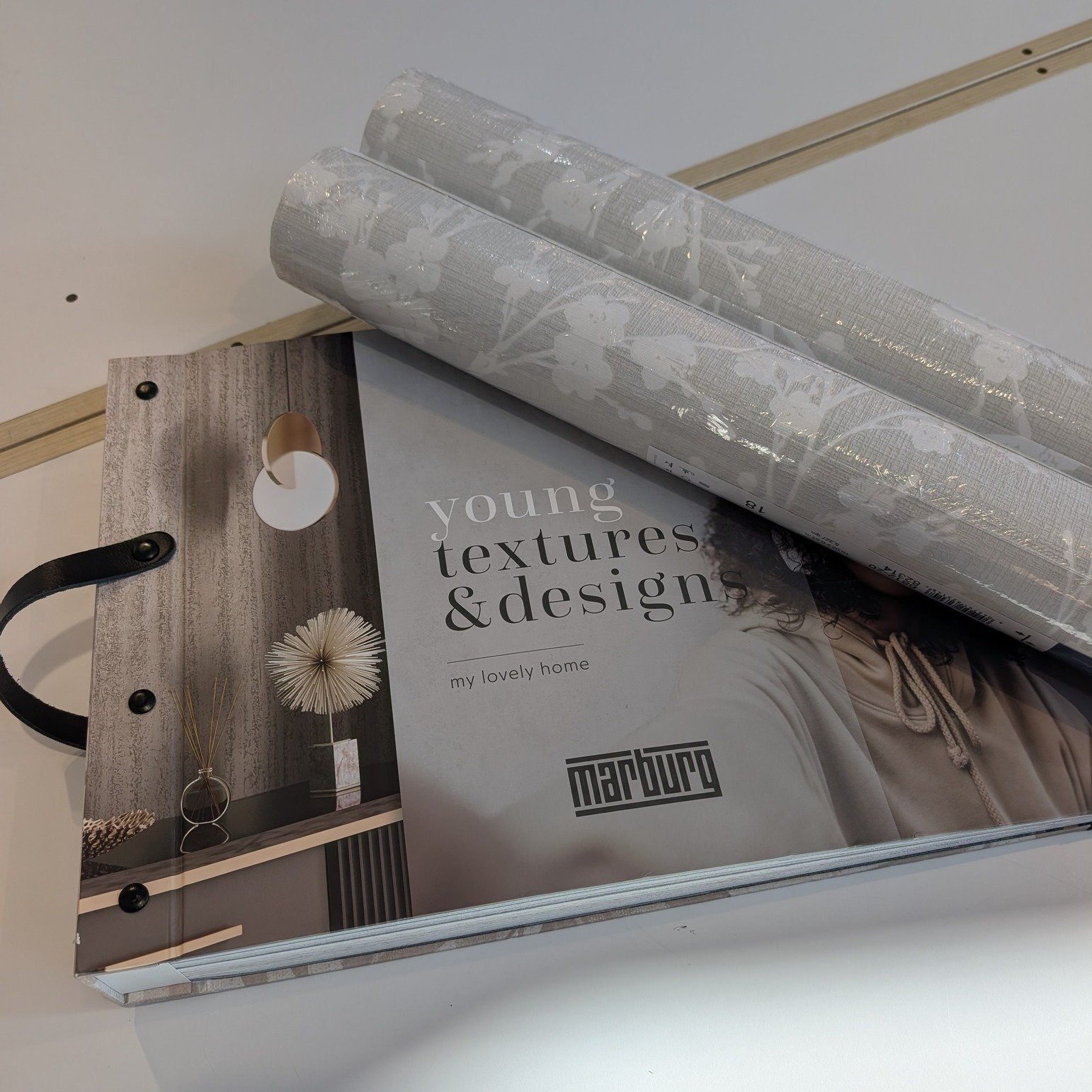 Ivy Novamur shows cherry blossom branches with structure, inspired by the Japanese Kyoto, in beige and white tones with glossy accents. Our client took their Powder Room renovation to the next level by adding this stunning, soft neutral floral patter