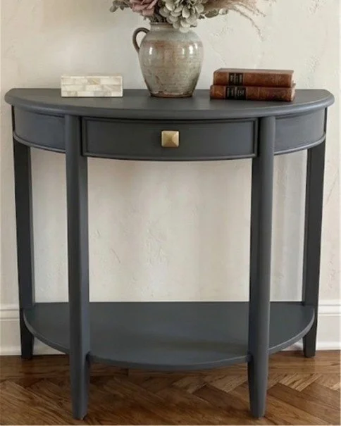 Gail, @gailsshabbytochic has a passion for restoring new life into older furniture pieces by taking them from drab to fab! This half moon console table features Cast Iron by @fusionmineralpaint, a true off-black that leans into its strong warm undert