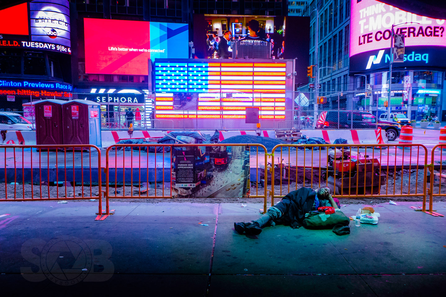 Walking to work through Times Square this morning at 6:57 A.M. and this scene kind of stopped me and reminded me a little of the current state of affairs in this country.