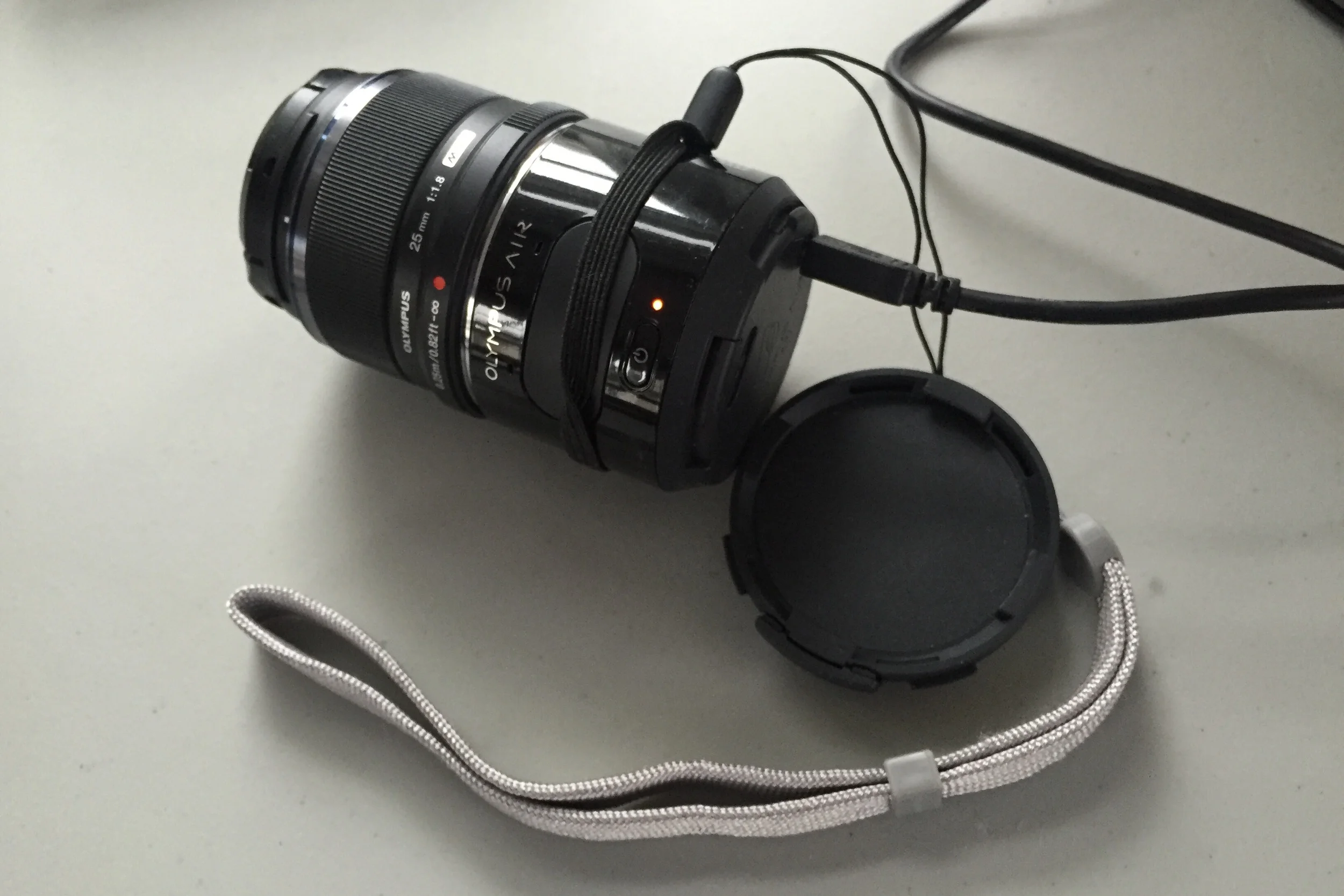 The Olympus Air with lens attached.