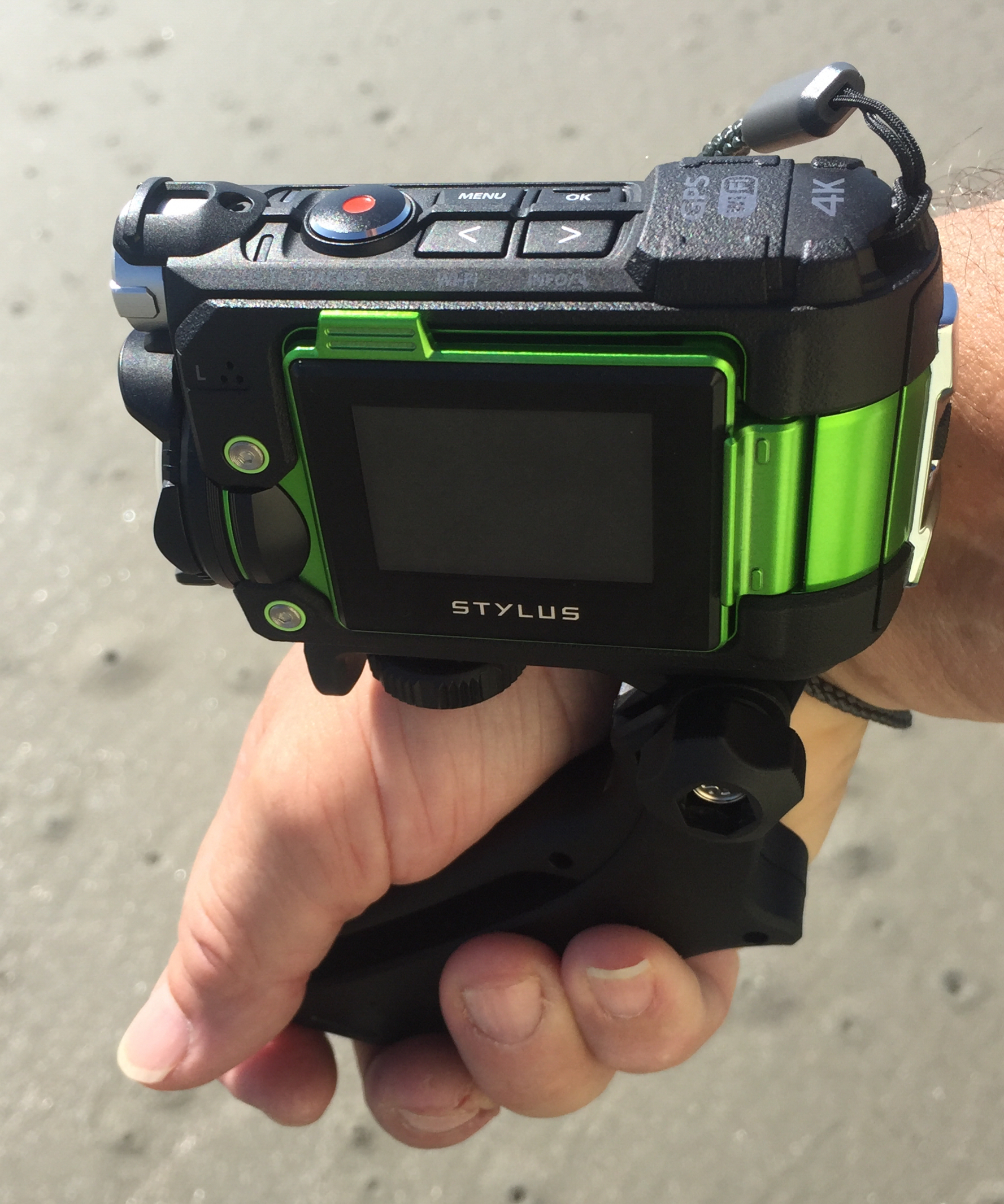 Putting grip on backwards allows you to hold the camera facing forward close to your side.