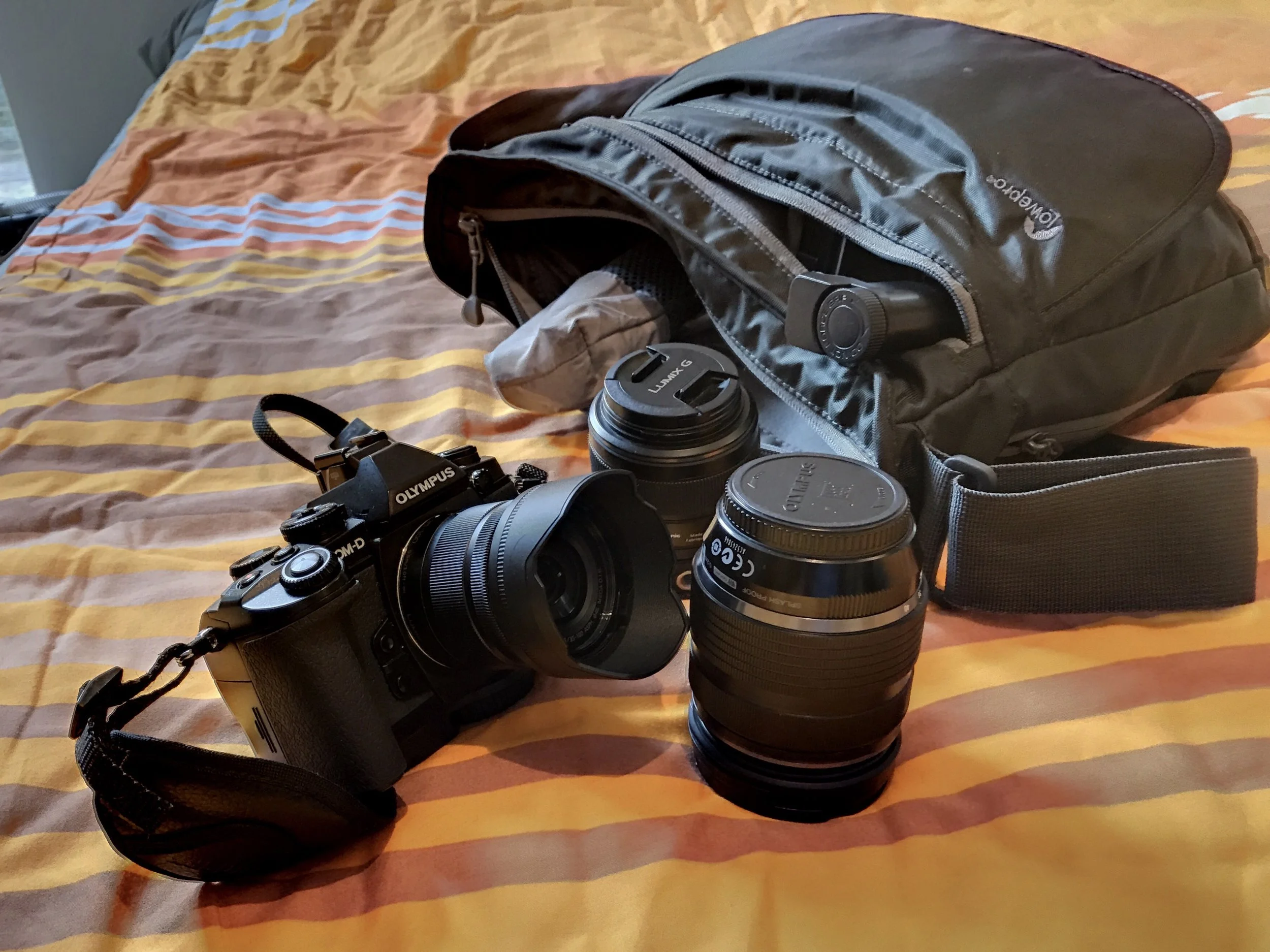 E-M1, GM-5 , and my 12-40mm with the Lowepro Streamline 250.