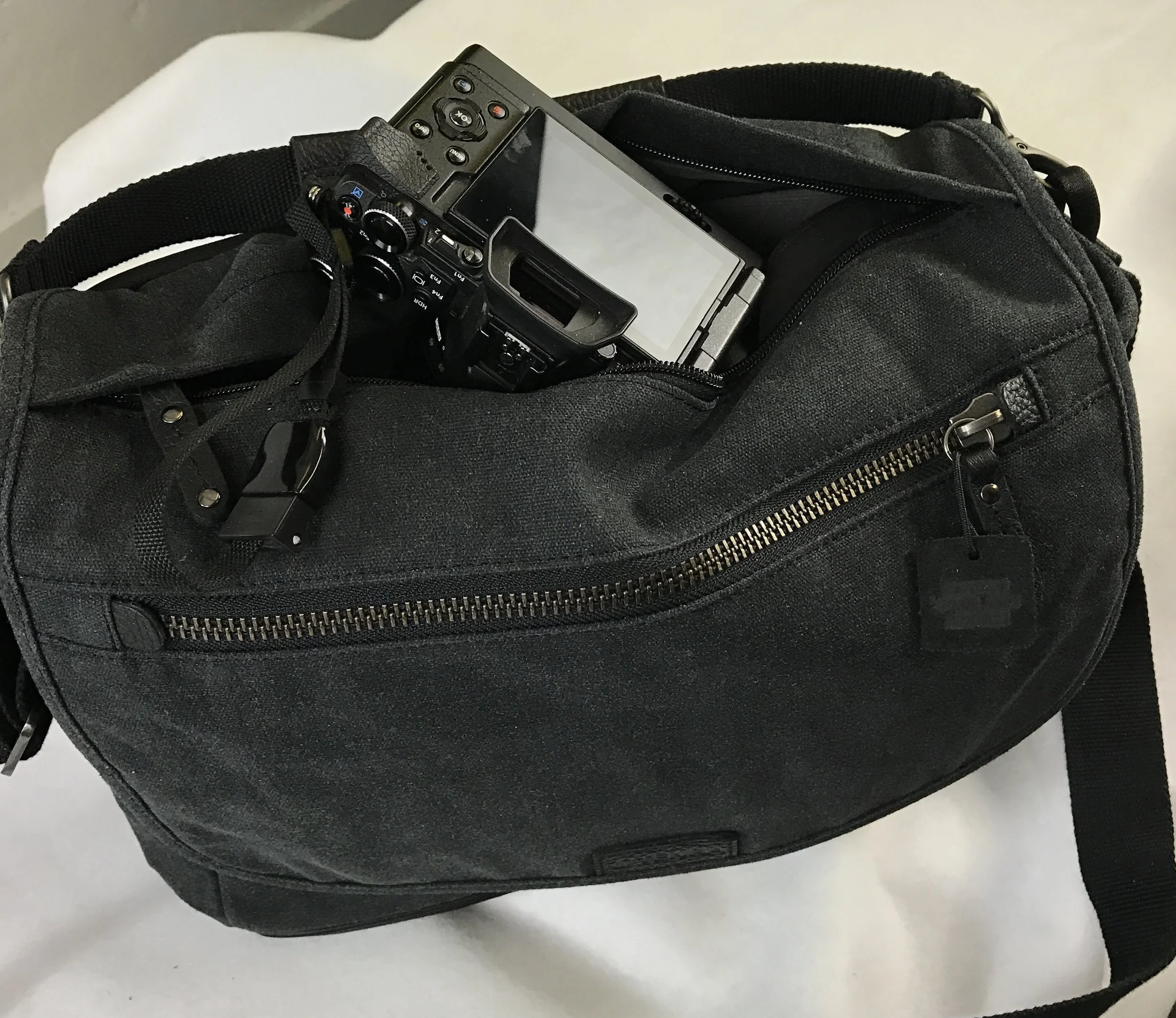 E-M5 II with 12-40 accessed through top opening.