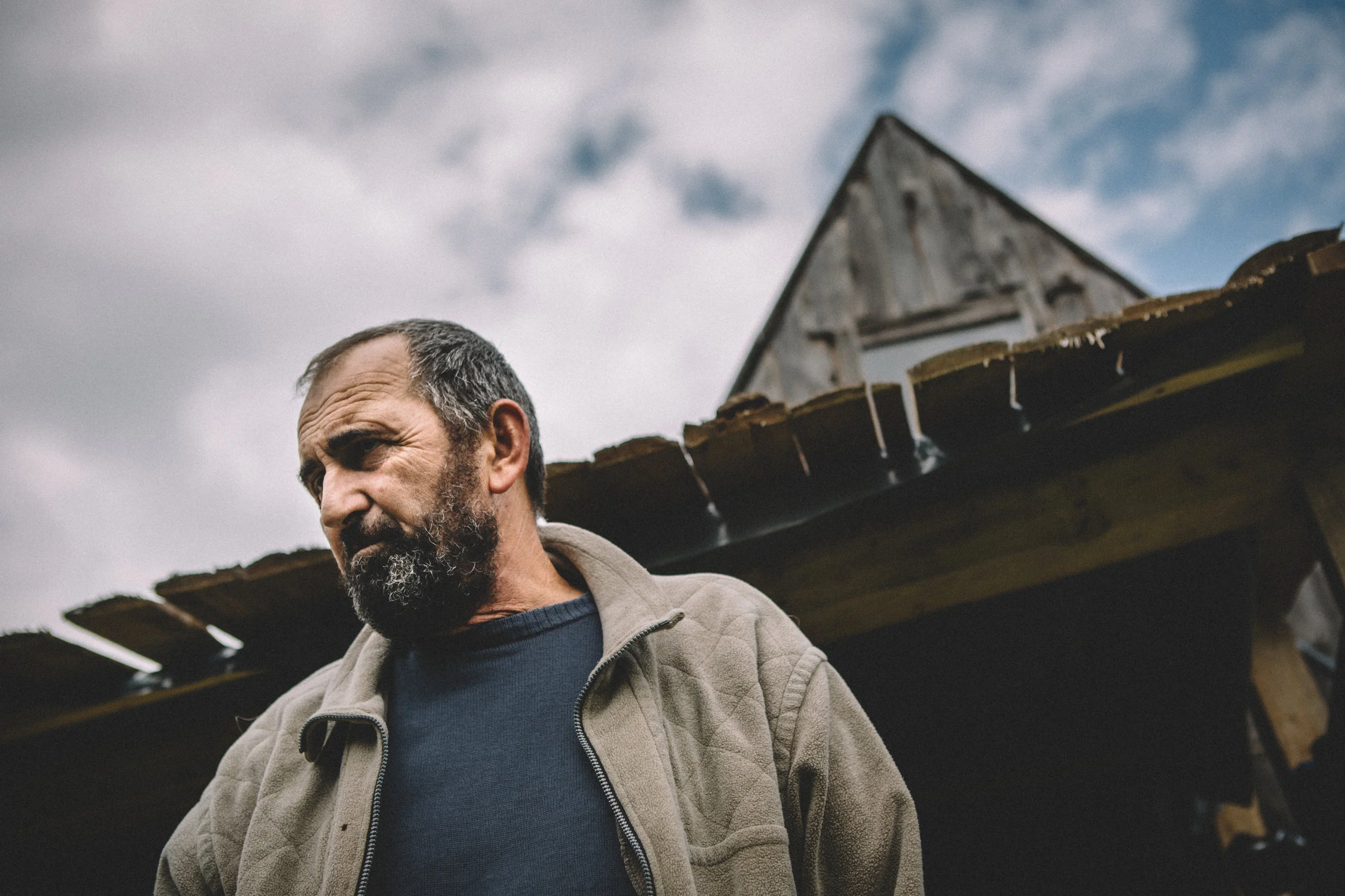  “I’m an anarchist. I like this life.”  Dragan in front of his self made house in the mountains surrounding Sarajevo.   Sarajevo, Bosnia, 2017 
