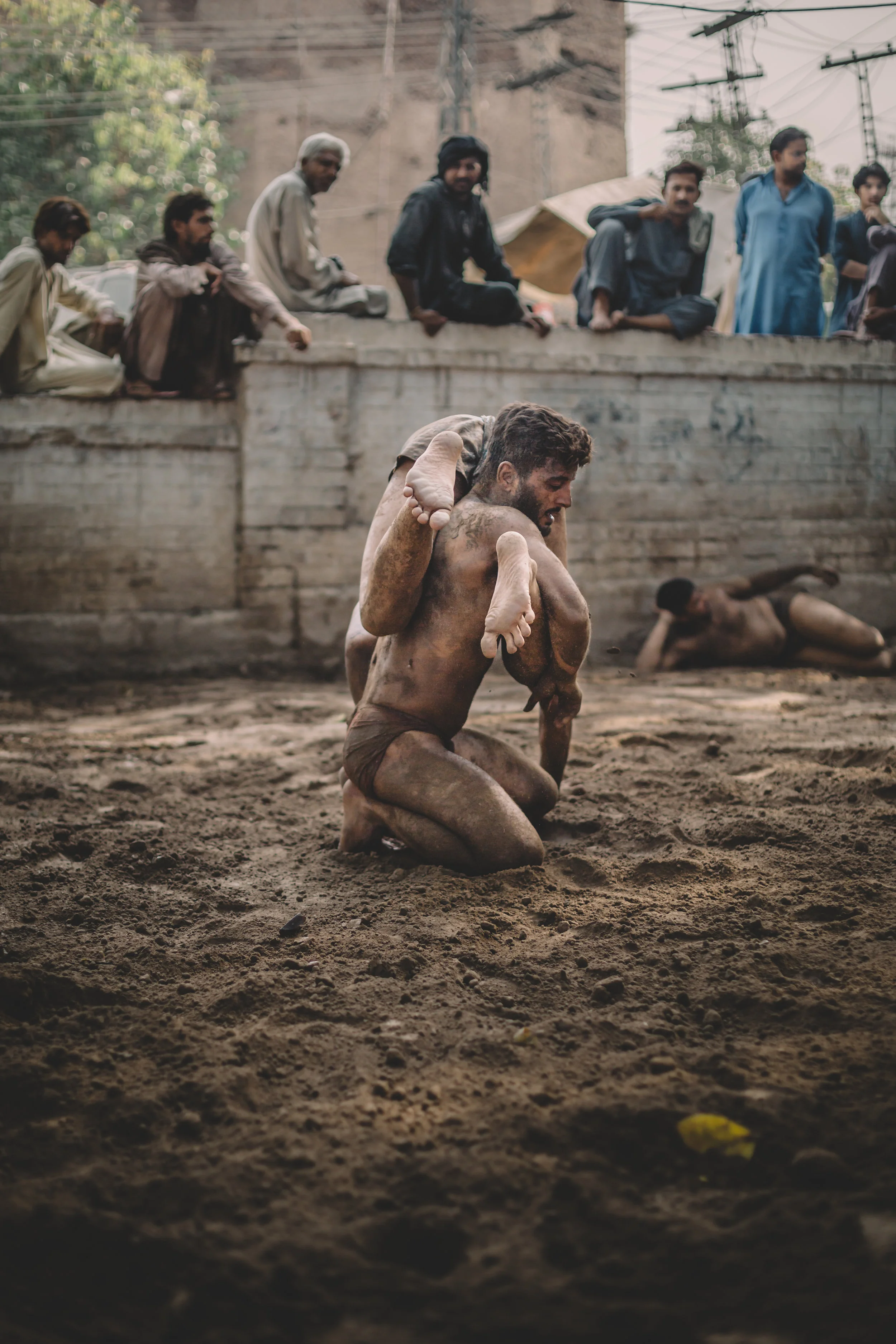  Spectators watch a Kushti wrestling match in Lahore, Pakistan, 2019. 