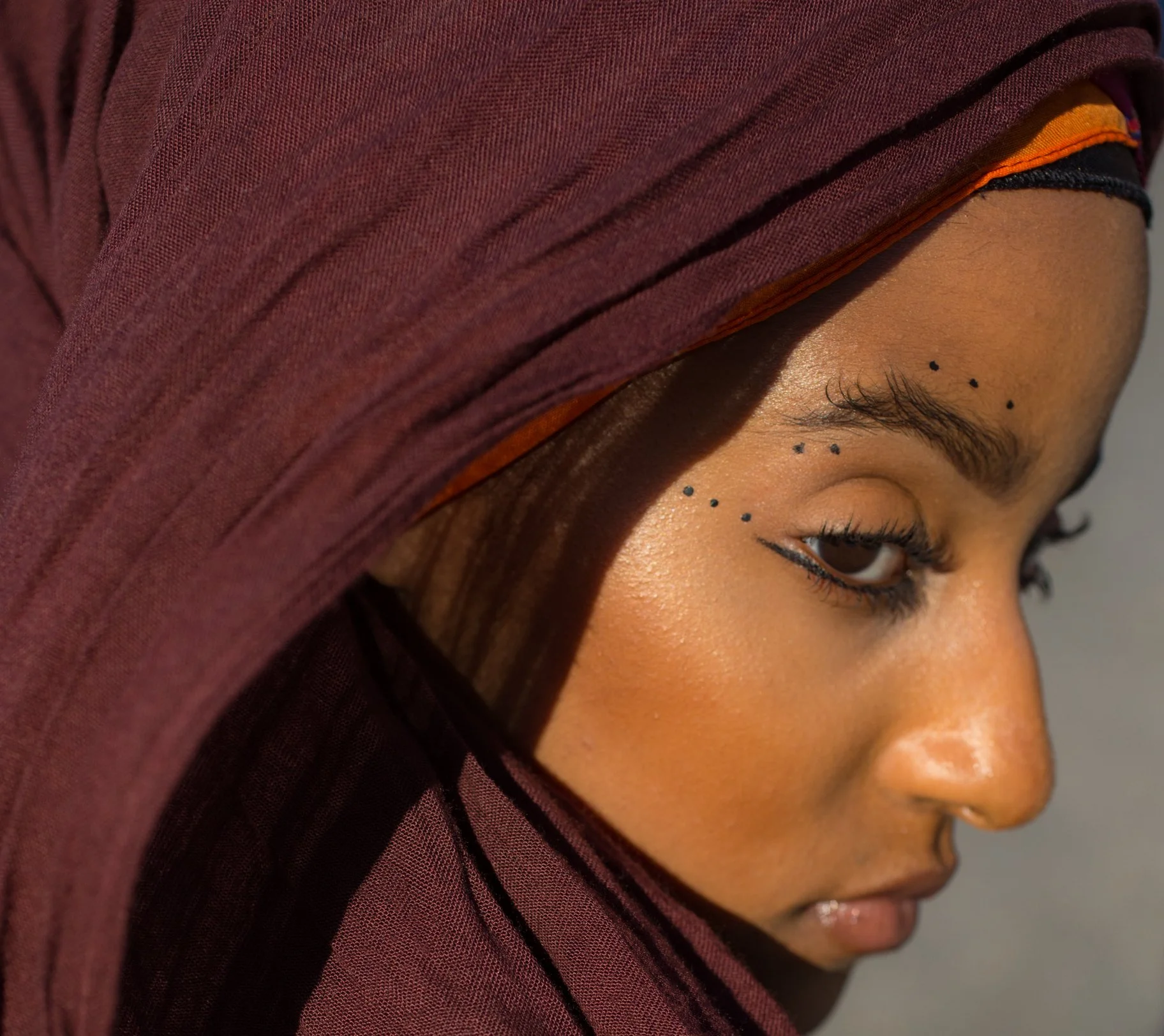 Portrait of a beautiful Pakistani woman in an office. Sunlight, shadows. Shot on Sony A7II. New York