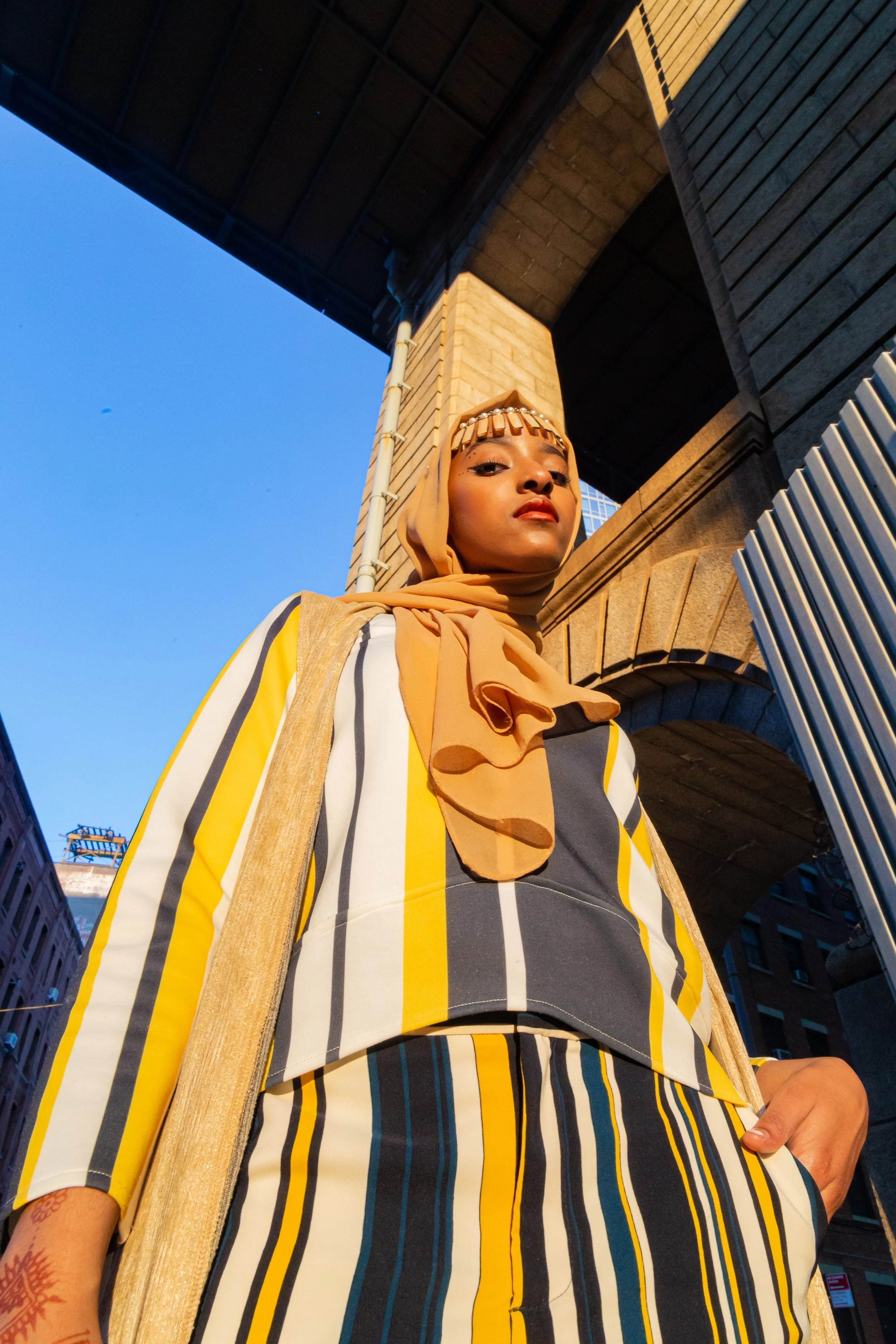 Powerful shot of muslim woman in Dumbo. Sunlight, shadows. Shot on Sony A7II. New York