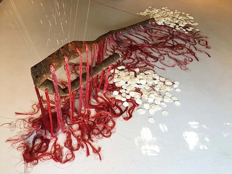  Segment of a Cycle, discarded rusty pipe, threads, handmade paper containing native seeds from the Northwest, dimension variable: I carried home a long, weathered pipe—its skin mottled with rust, its hollow now cradling hundreds of small, handmade p