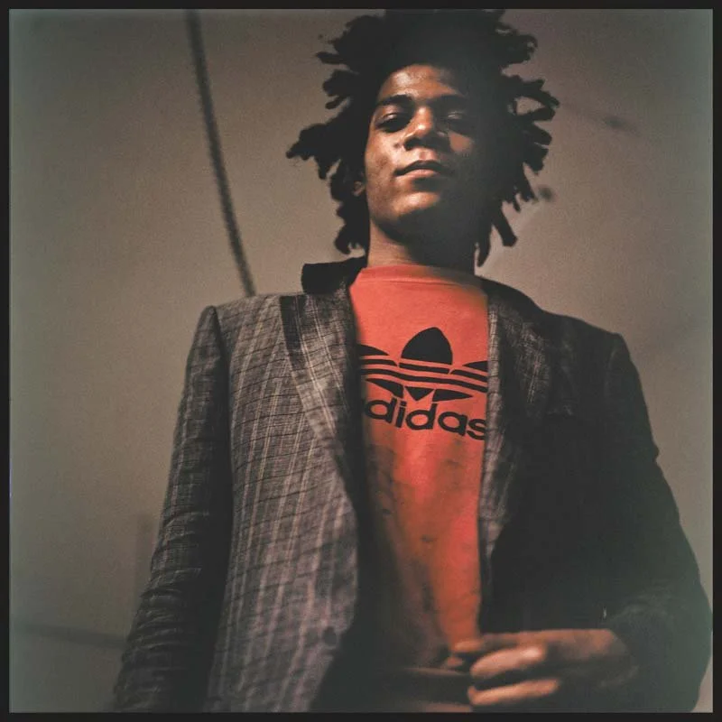 Jean-Michel Basquiat around the time he started working in the basement studio provided by Annina Nosei, 1981.  © Edo Bertoglio  