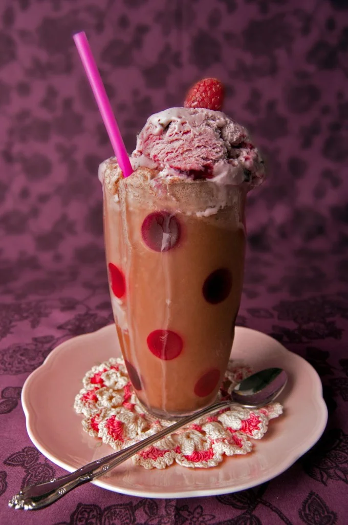 Could you use one of these today? The sun is out and beginning to beat harder as Spring gets well underway. Here’s a recipe for an icy, sweet treat to cool you down if you’ve been hitting the dirt in the garden or walking the dog! Chocolate Black Raspberry Ice Cream Soda