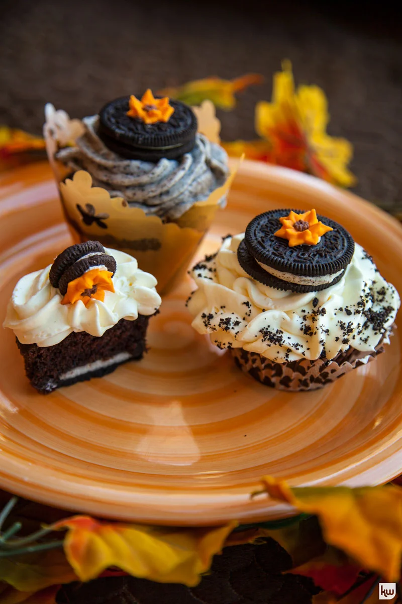 Sour Cream Chocolate Cupcakes with Vanilla Vodka Frosting
A novel approach to a perennial favorite, they are hauntingly delicious. These cupcakes are a great addition to a grown up Halloween party - the icing is enhanced with vanilla vodka. They are so good it is scary!!!
- Barbara Esatto, The Chocolate Goddess Cupcake Ingredients:
½ cup Unsweetened Hot Cocoa
½ cup Boiling Water 1 ½ cups All Purpose Flour 1 teaspoons Baking Soda ½ teaspoon Baking Powder ½ teaspoon of Salt ¾ cup Brown Sugar ½ cup Granulated Sugar 2 Large Eggs 2 teapoon Vanilla Extract 1 cup Sour Cream ½ cup Vegetable Oil 15-18 Double Stuff Oreos® to line cupcake cups Vanilla Vodka Cookies & Cream Frosting:
8 ounces Cream Cheese
1 stick (4 ounces) Unsalted Butter 1 pound Confectioner’s Sugar 3 tablespoons Vanilla Vodka ¾ cups ground Oreos® (about 8 cookies) Baking Instructions:
- Preheat over to 350 degrees. Place cupcake cups in muffin tins.
- Bring water to a boil and add cocoa, stirring until dissolved. Set aside. - Combine dry ingredients and set aside. - Place sugars in a mixing bowl. Add eggs, vanilla, oil and sour cream and combine well. - Add chocolate and flour mixture alternately. - Place a tablespoonful of batter on bottom of cupcakes cups. Place Oreos® in bottom of the cup. Fill ¾ full with batter. - Bake for about 18 minutes until toothpick inserted comes out clean. - Cool for 15 minutes and remove cups. Frost cupcakes when fully cool. Frosting Instructions:
- Let butter stand out at room temperature for about 30-30 minutes. - Crumble Oreos® in food processor. - Beat butter, add cream cheese and combine well. Add vodka slowly to spreading consistency. - Fold in crumbles - or if you prefer, divide frosting and reserve some crumbles for garnish