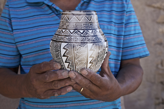  Hands of Acoma potter Gary Louis with our new horsehair pot. 