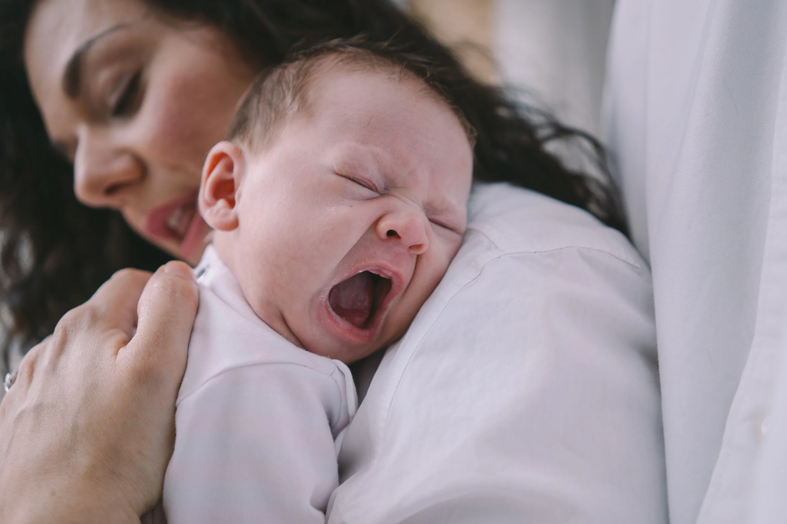 baby-yawning-on-mamas-shoulder.jpg