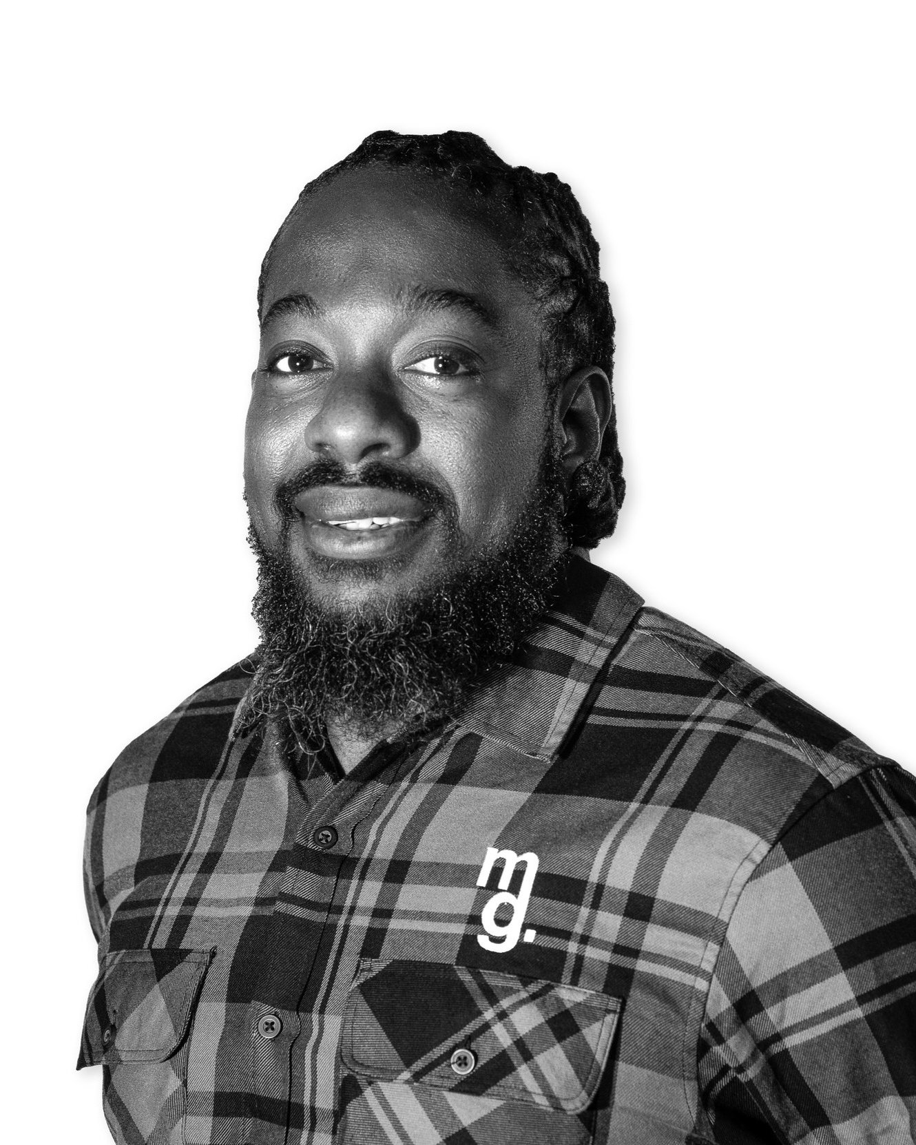 Black and white portrait of a man with a beard and mustache, wearing a plaid shirt with a logo on the chest.