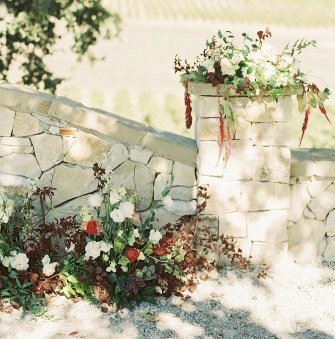 The rock wall makes such a statement 🌿 with florals along the base + tall arrangements on the pillars, it created the perfect frame for this stunning ceremony.⁠
⁠
Planner: @gracelorenzenevents⠀⁣⁣⁣⁣⁣⁠
Photographer: @kelseaholderphoto⁣⁣⁣⁣⁣⁠
Venue: @an