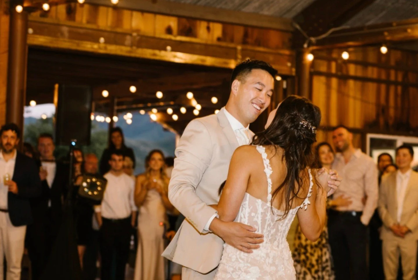 Your first dance under the glow of the Ancient Peaks Barn lights ✨