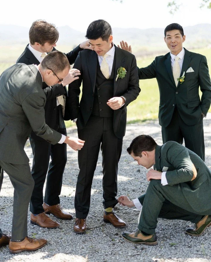 When the groomsmen take their role very seriously &mdash; final checks, big laughs, and a whole lot of hype 🤍