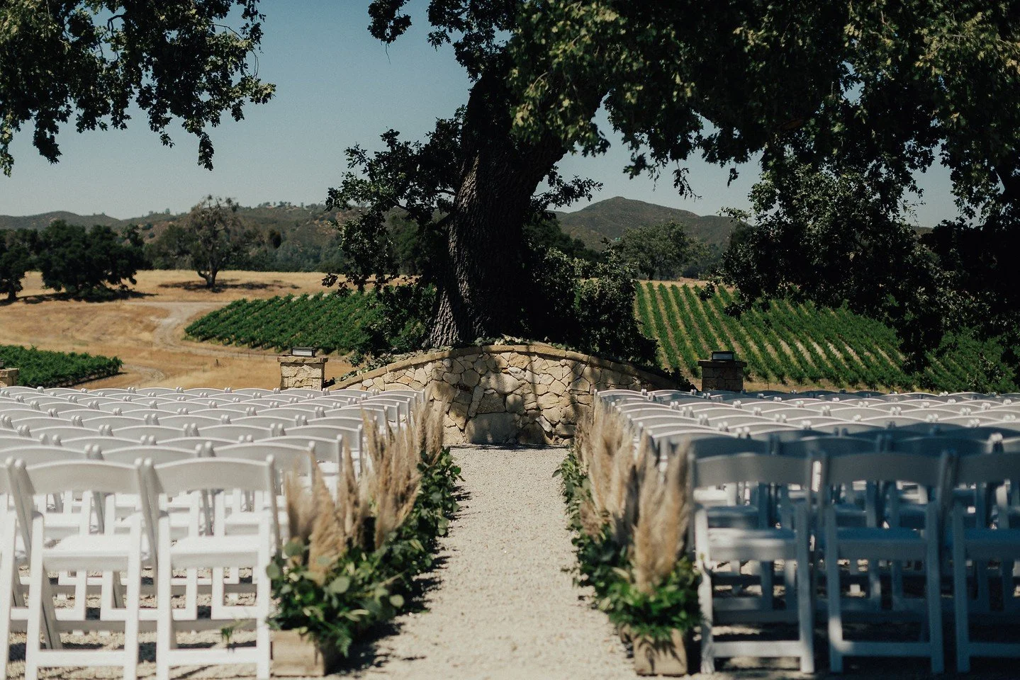 A view this beautiful only needs two things: you and your forever. Set about the vineyard, our ceremony site was made for moments like this.