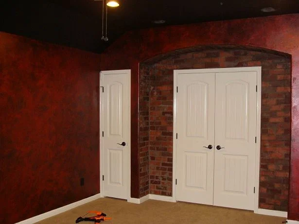 Faux brick & metallic walls for media room