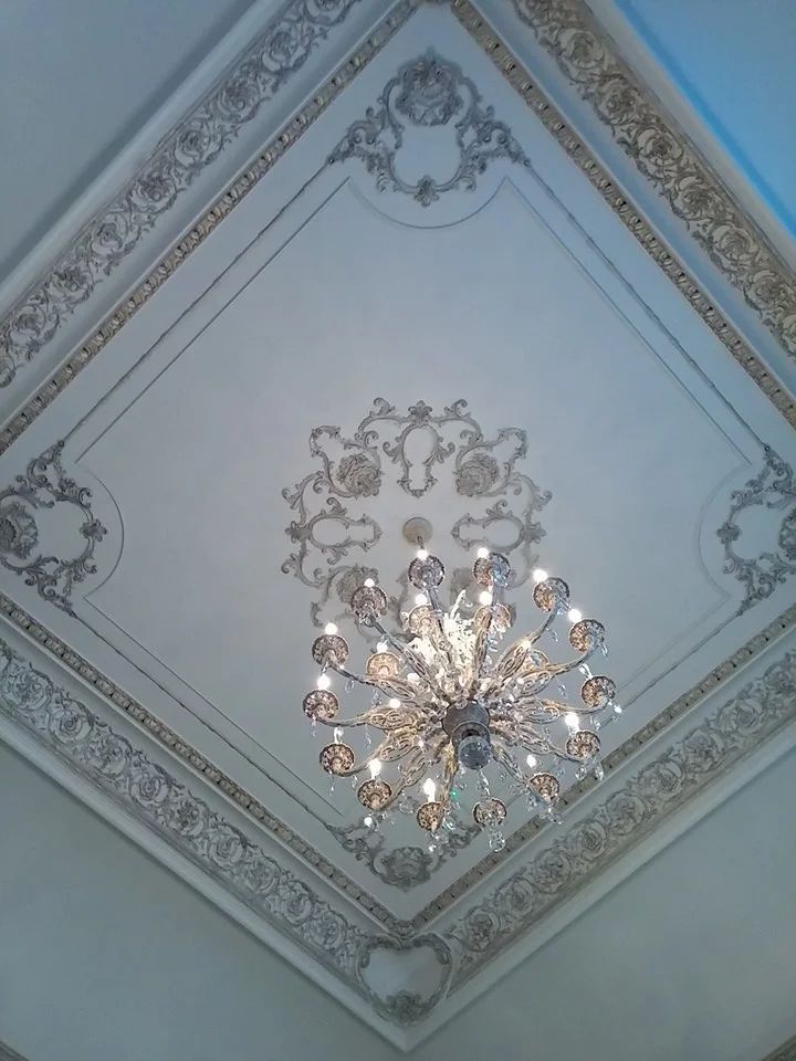 Hand painted architectural moldings in golds and bronze