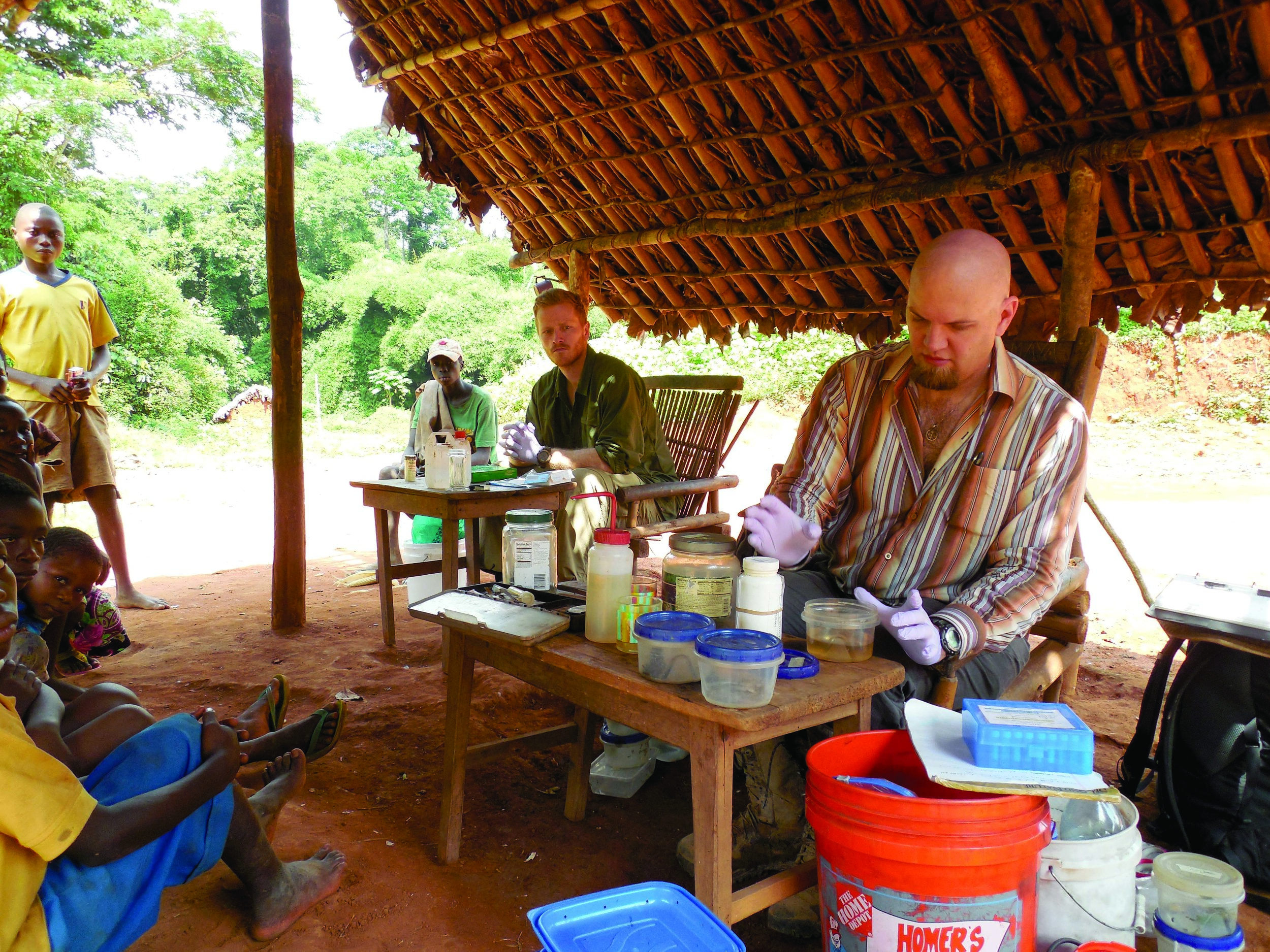Associate Professor of Biological Sciences Eli Greenbaum (center) is seen with a Npenda village chief (on Greenbaum’s right), villagers and expedition team members near Lake Tumba, Equator Province, Democratic Republic of Congo. Photo courtesy of Eli Greenbaum