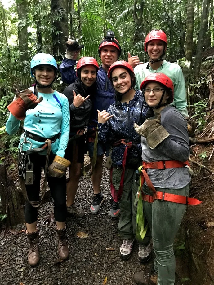 Natassia Lozano, foreground second from right, joins other MHIRT scholars on a zip line and water rafting excursion through the Costa Rican rainforest. Photo courtesy of Natassia Lozano.