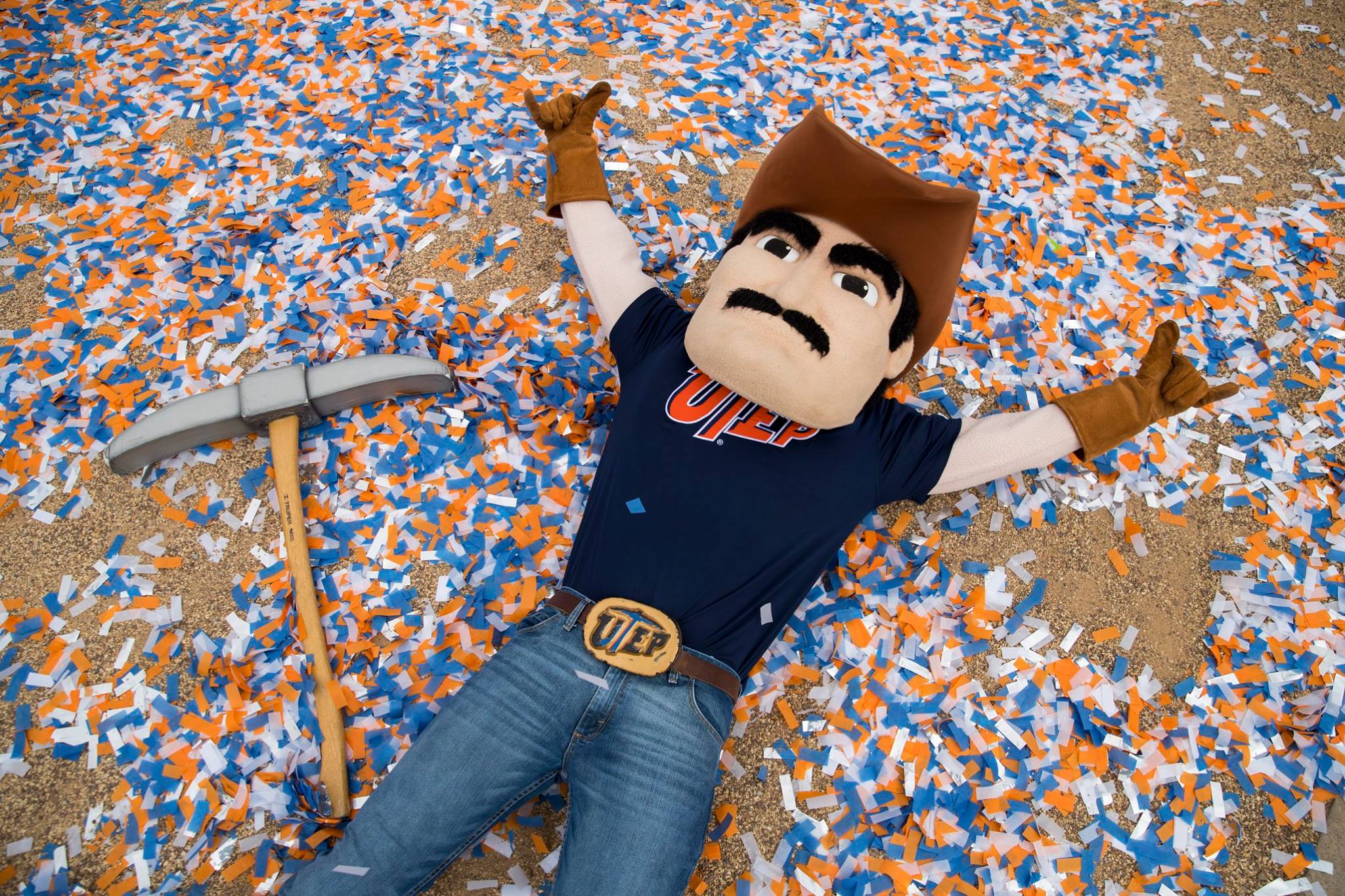 Paydirt Pete makes a confetti angel at UTEP's celebration of its R1 designation from the Carnegie Classification of Institutions of Higher Education on Jan. 29 in Centennial Plaza. Students, faculty and staff gathered to as President Diana Natalicio spoke about the distinctionUTEP Cheerleaders, the Marching Miners, and the Golddiggers joined in the celebration.
